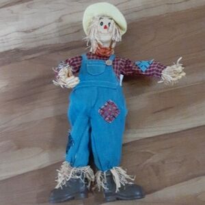 Charming Ceramic Scarecrow with Blue Overalls and Yellow Hat